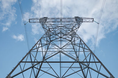 Metal pylon of a power line against the sky. 
 topics of generation and supply of electricity.