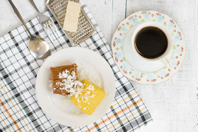 High angle view of coffee served on table