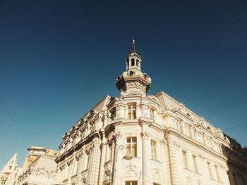 Low angle view of church against blue sky