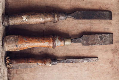 Directly above shot of rusty work tools on table