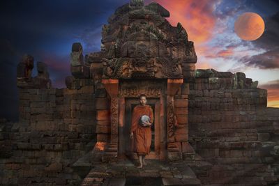 Statue of temple against cloudy sky