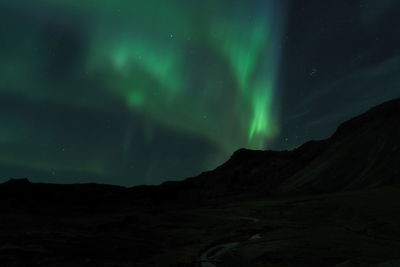 Low angle view of mountain against sky at night