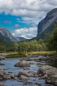 Scenic view of lake and mountains against sky