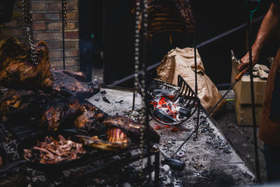 Midsection of man roasting food