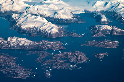 Aerial view of frozen lake and mountains