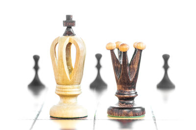 Close-up of chess board against white background