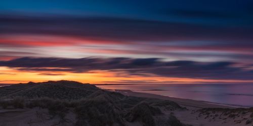 Scenic view of dramatic sky during sunset