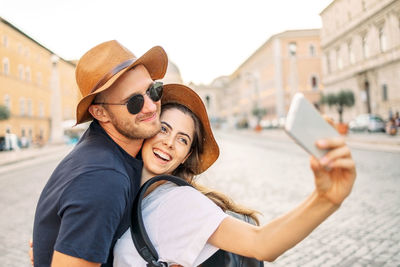 Portrait of young woman using mobile phone