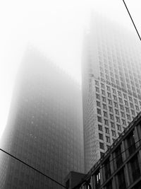 Low angle view of modern buildings against sky in city