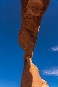 Low angle view of rock formation against blue sky