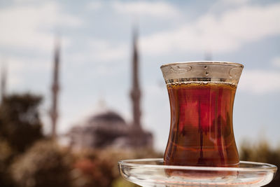 Close-up of turkish tea against sky