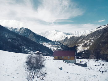 Scenic view of snowcapped mountains against sky