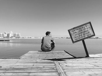 Woman standing on pier