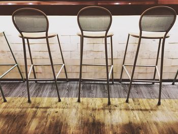 Empty chairs and tables on hardwood floor