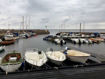 Boats moored at harbor