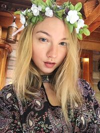 Portrait of young woman with flowers