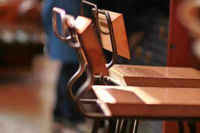 Close-up of wooden chairs on floor