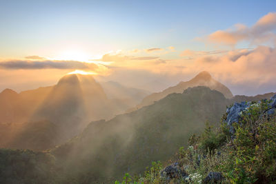 Scenic view of mountains against sky during sunset