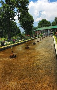 Fountain in park against sky