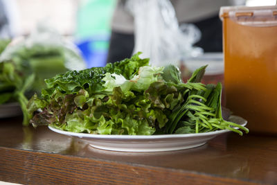 Close-up of leaf vegetables in plate on table