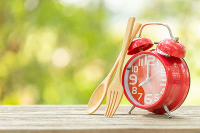 Close-up of clock on table