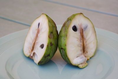 High angle view of fruits in plate on table