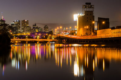 Reflection of illuminated buildings in water at night