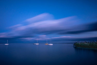 Scenic view of sea against sky at night