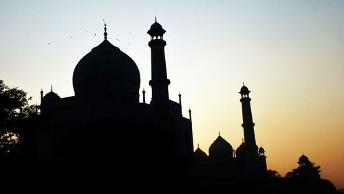 Low angle view of silhouette cathedral against sky