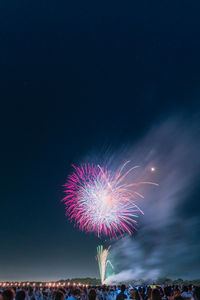 Firework display at night