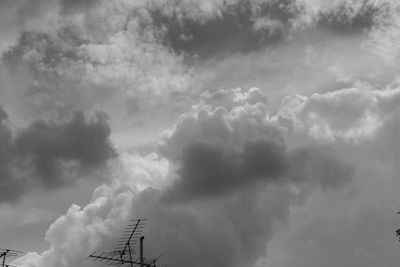 Low angle view of communications tower against sky