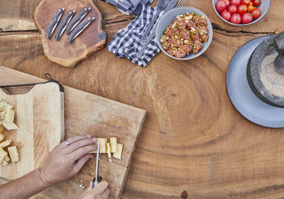 Chef preparing charcuterie board outdoors