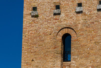 Low angle view of old building against sky