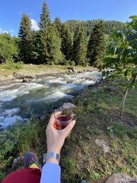 Low section of person in waterfall