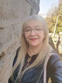 Portrait of smiling young woman outdoors