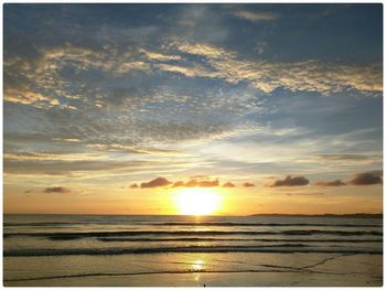 Scenic view of sea at sunset
