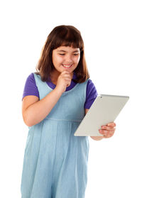 Portrait of a smiling young woman standing against white background