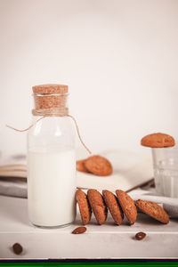 Close-up of cookies in glass on table