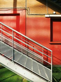 Metallic staircase against building