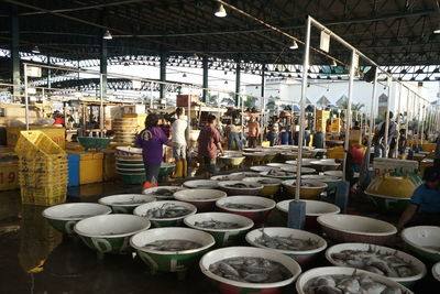 Group of people at market stall