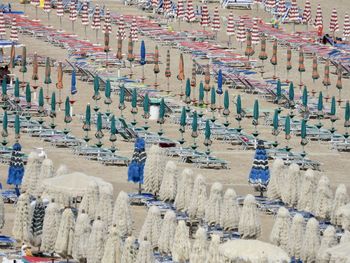 High angle view of closed parasols on a beach