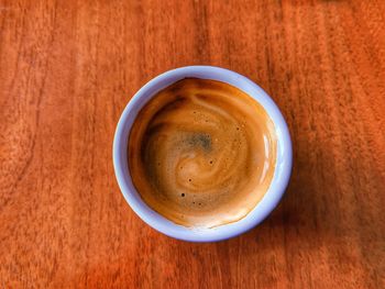 An italian coffee on a wooden table