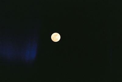 Low angle view of moon against sky at night