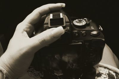 Close-up of hand holding mobile phone