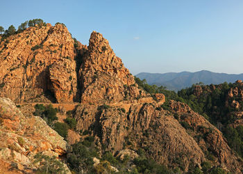 Beautiful panorama of the red rocks of west corsica france at sunset