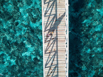 High angle view of people swimming in pool