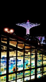 Low angle view of illuminated building at night