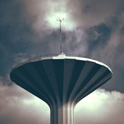 Low angle view of building against cloudy sky