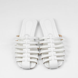 Close-up of shoes against white background