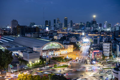 High angle view of illuminated buildings in city at night